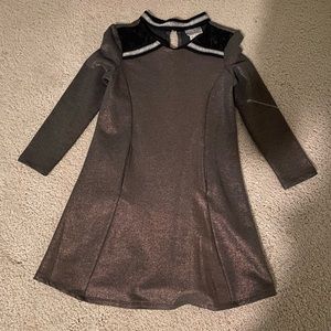 Size 7 long sleeve dress. Gold with black and silver detail. Never worn.